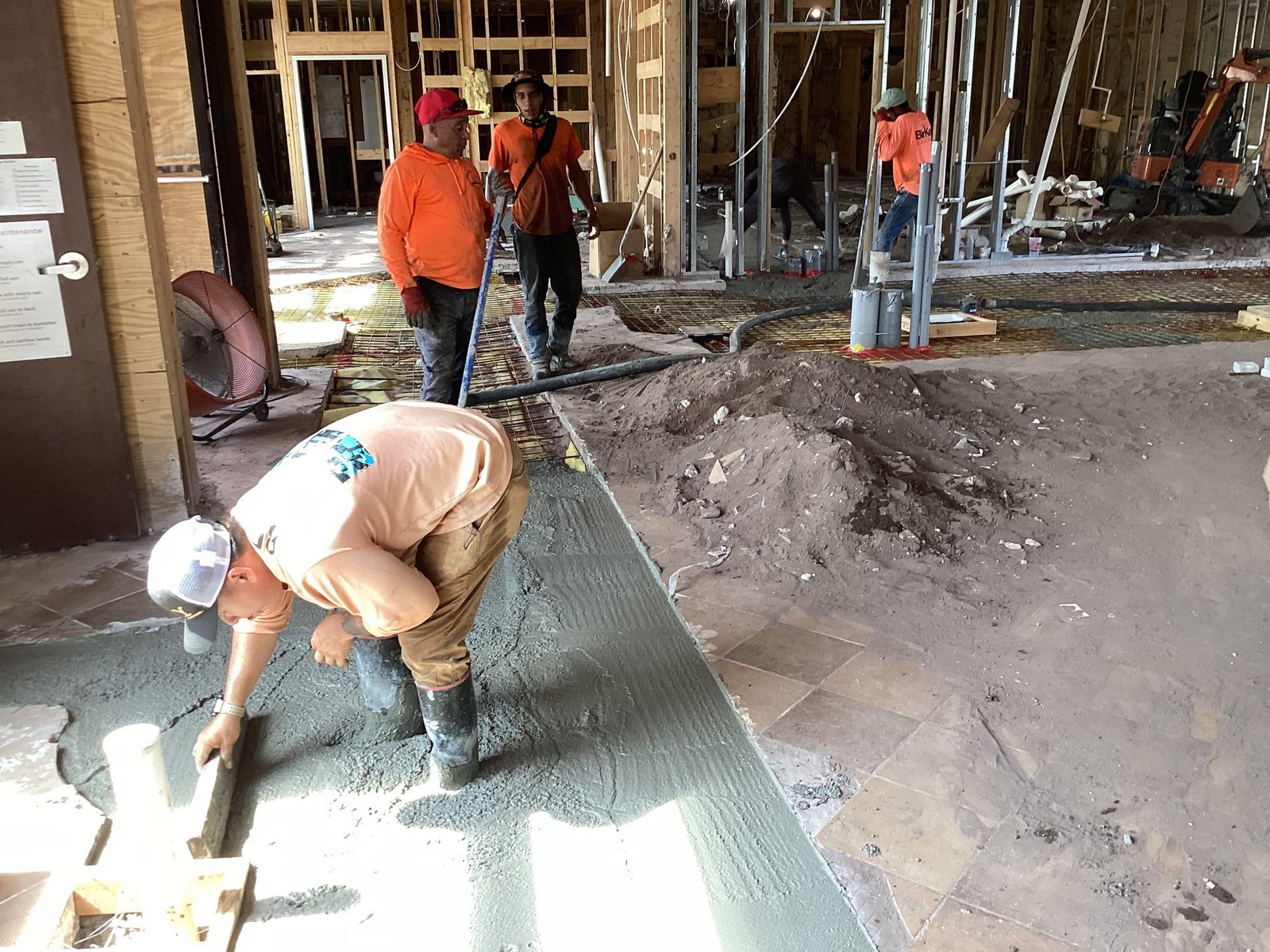 Final finishing touches on concrete at Chick-fil-A Oakleaf.